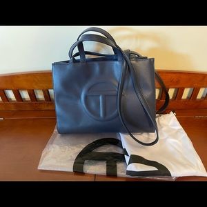 Gently used medium navy Telfar shopping bag. Like new with bags and tags.
